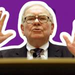 Warren Buffett speaks at podium with his hands in the air