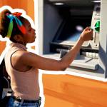 Beautiful african women using ATM machine. Attractive young woman withdrawing money from credit card at ATM.