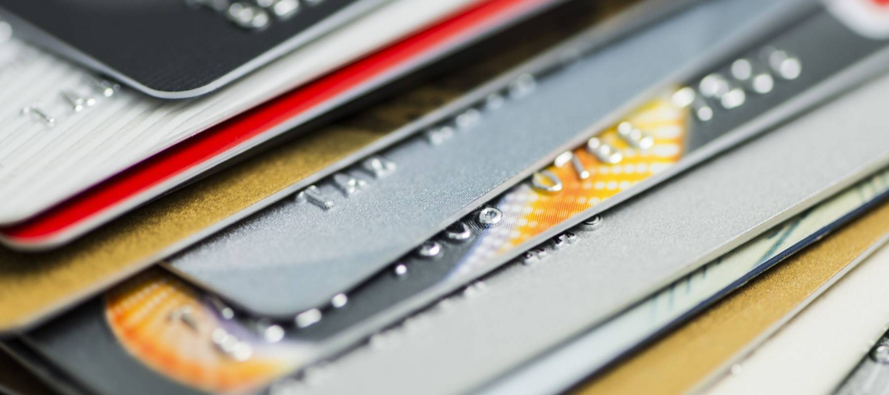 Stack of multicolored credit cards close-up