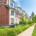 Nice neighborhood on a sunny day. Townhouses in the suburbs of the North America. Canada.