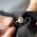 Jeweller cleaning jewelry diamond ring with fabric cloth