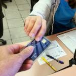 Close up of woman holding credit card and smartphone