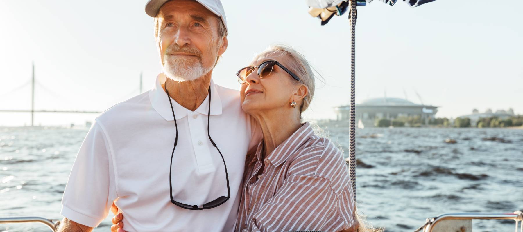 A couple embrace on a private yacht.