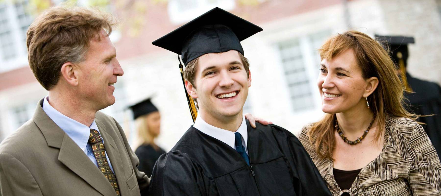 Graduation: Proud Male Student With Parents