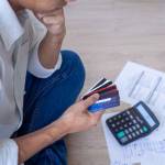 Business men sitting stressed out with home expenses and monthly credit card debt.