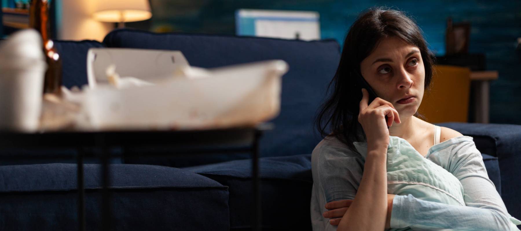 A woman worries about credit-card bills.