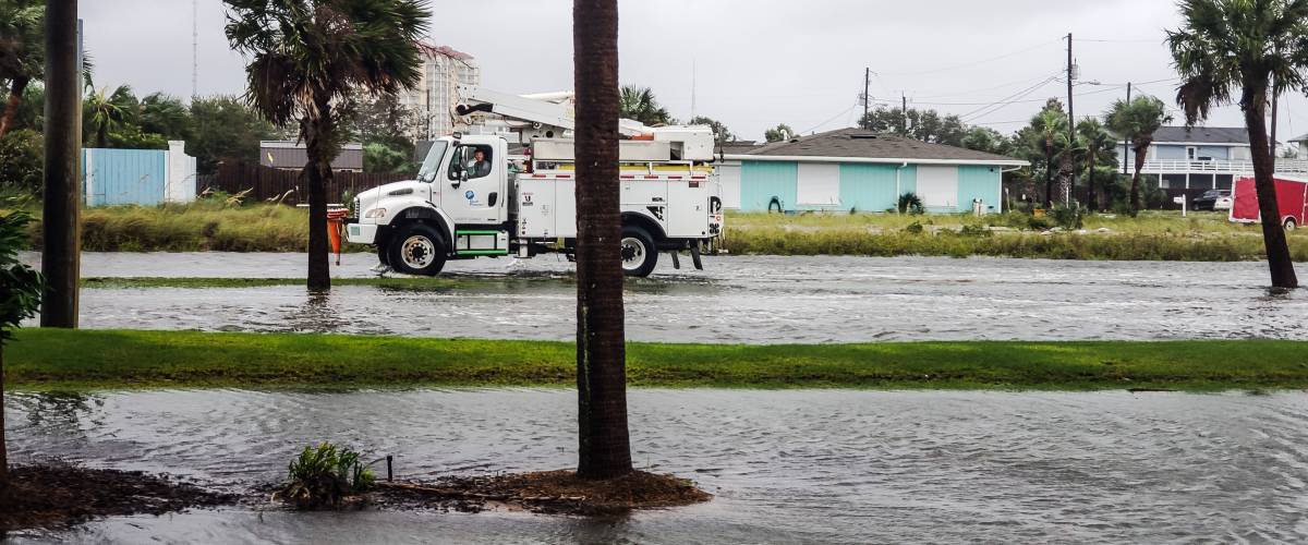 Hurricane damage on water logged roads at the beach community.