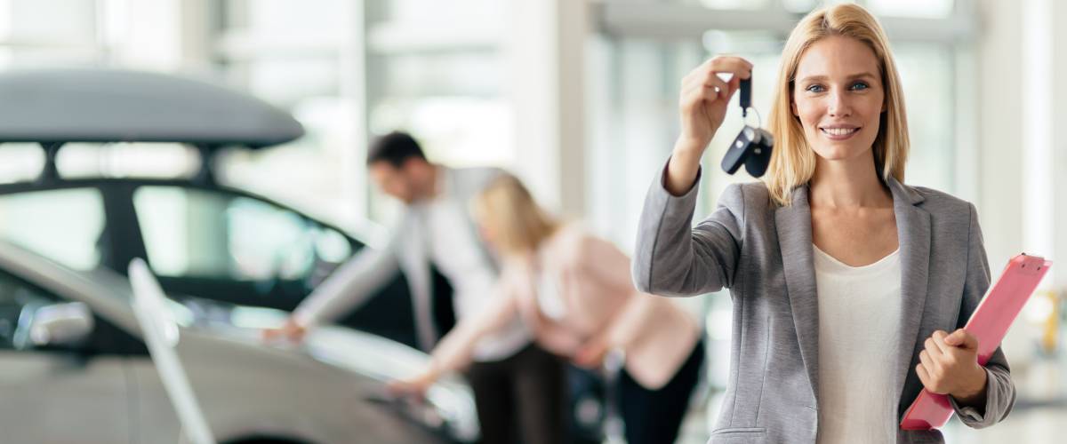 Professional salesperson in car dealership