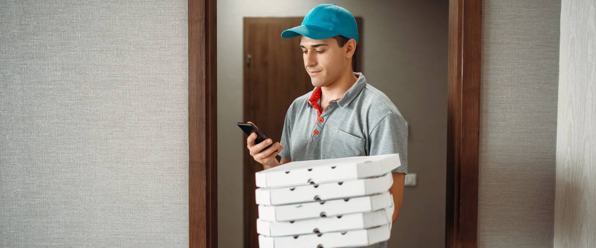 Pizza delivery boy calls to customer
