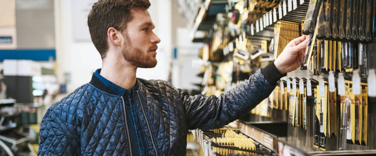 Bearded young man in a hardware store