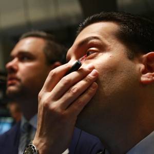 Traders work on the floor of the New York Stock Exchange moments after the opening bell October 13, 2008 in New York City.