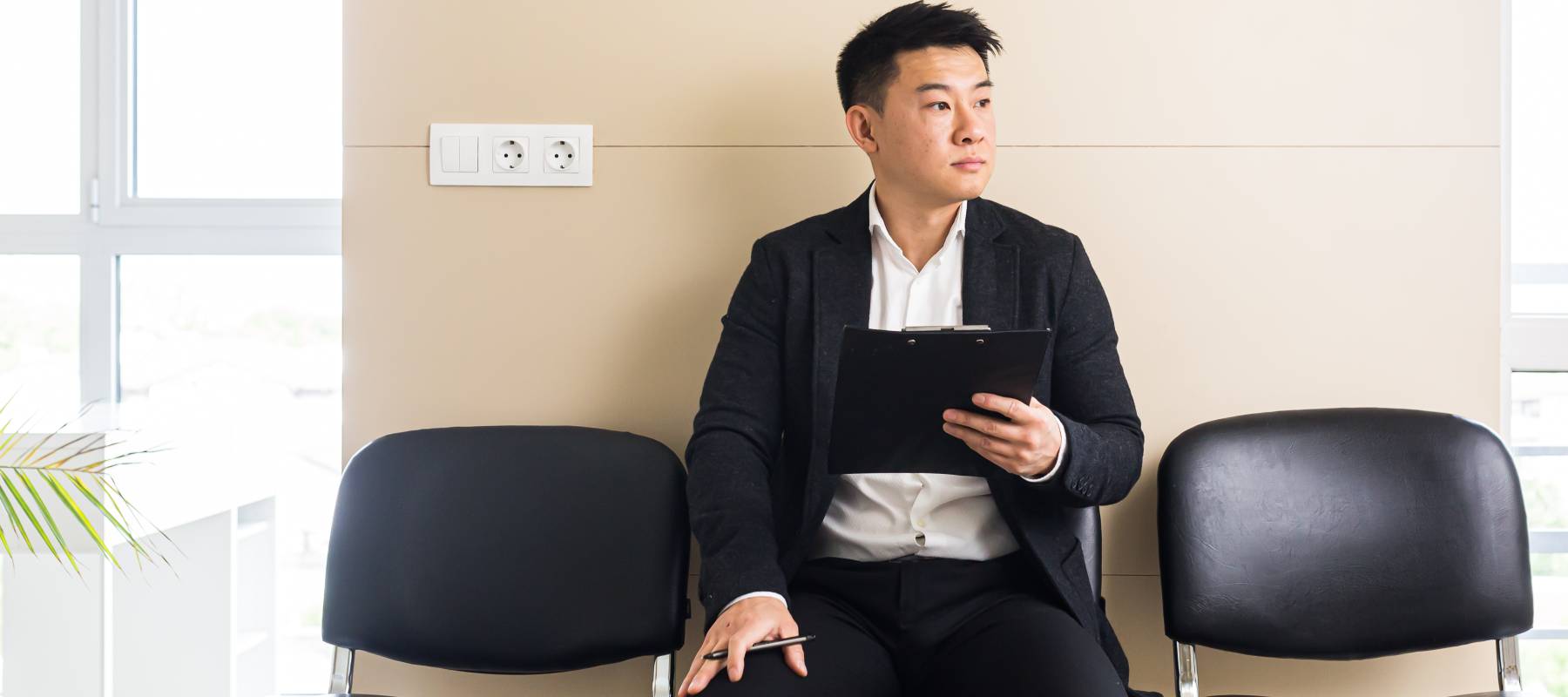 A man waiting for a job interview, with Americans face an uncertain job market.
