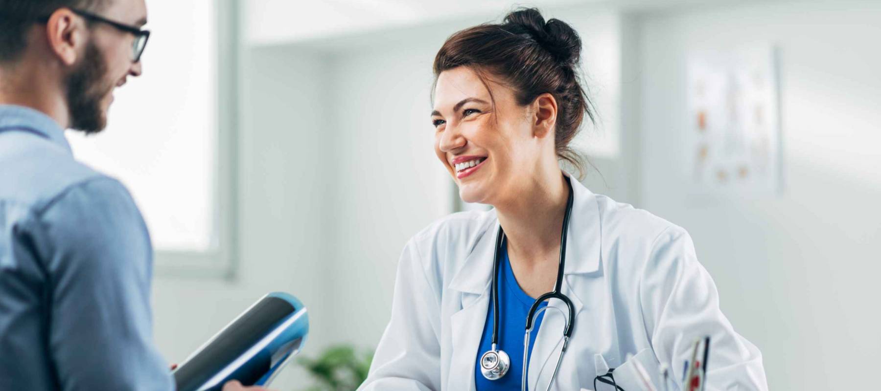 Doctor and patient sitting in doctor's office