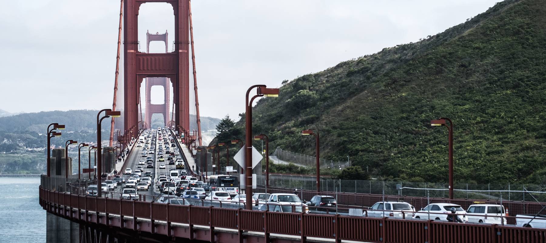 The Golden Gate Bridge, with all six lanes filled, is one of at least 20 roadways tolled by California.