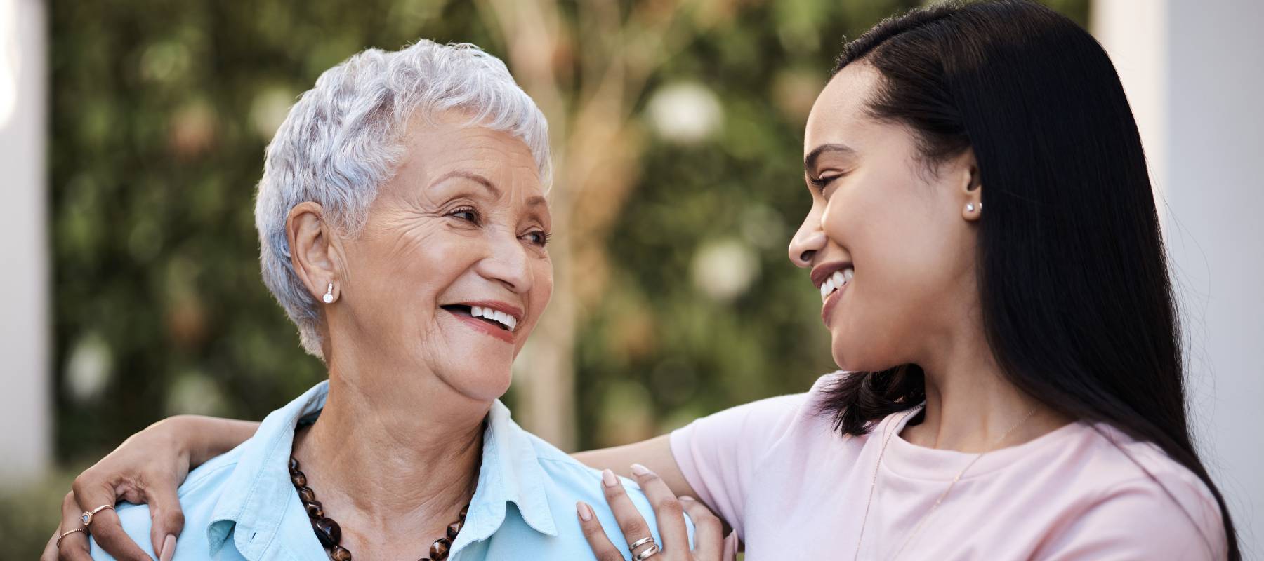 Shot of a senior woman spending time with her daughter in their garden at home.