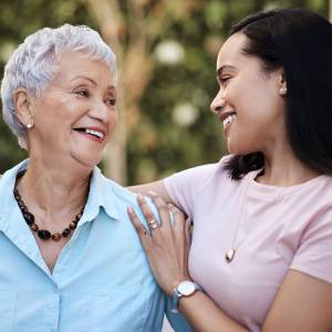 Shot of a senior woman spending time with her daughter in their garden at home.