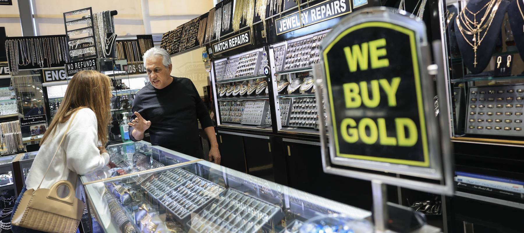 Yair Yacoby helps a customer at his Magic Jewelers, Inc shop in the International Jewelers Exchange on January 27, 2026 in Aventura, Florida.