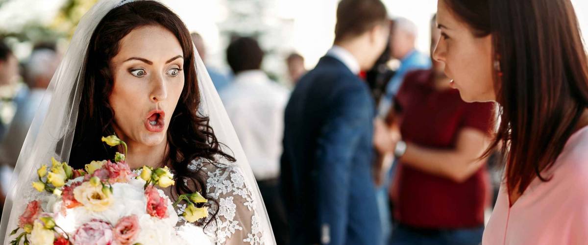 Bride, guests and bridesmaids at  wedding ceremony outdoors