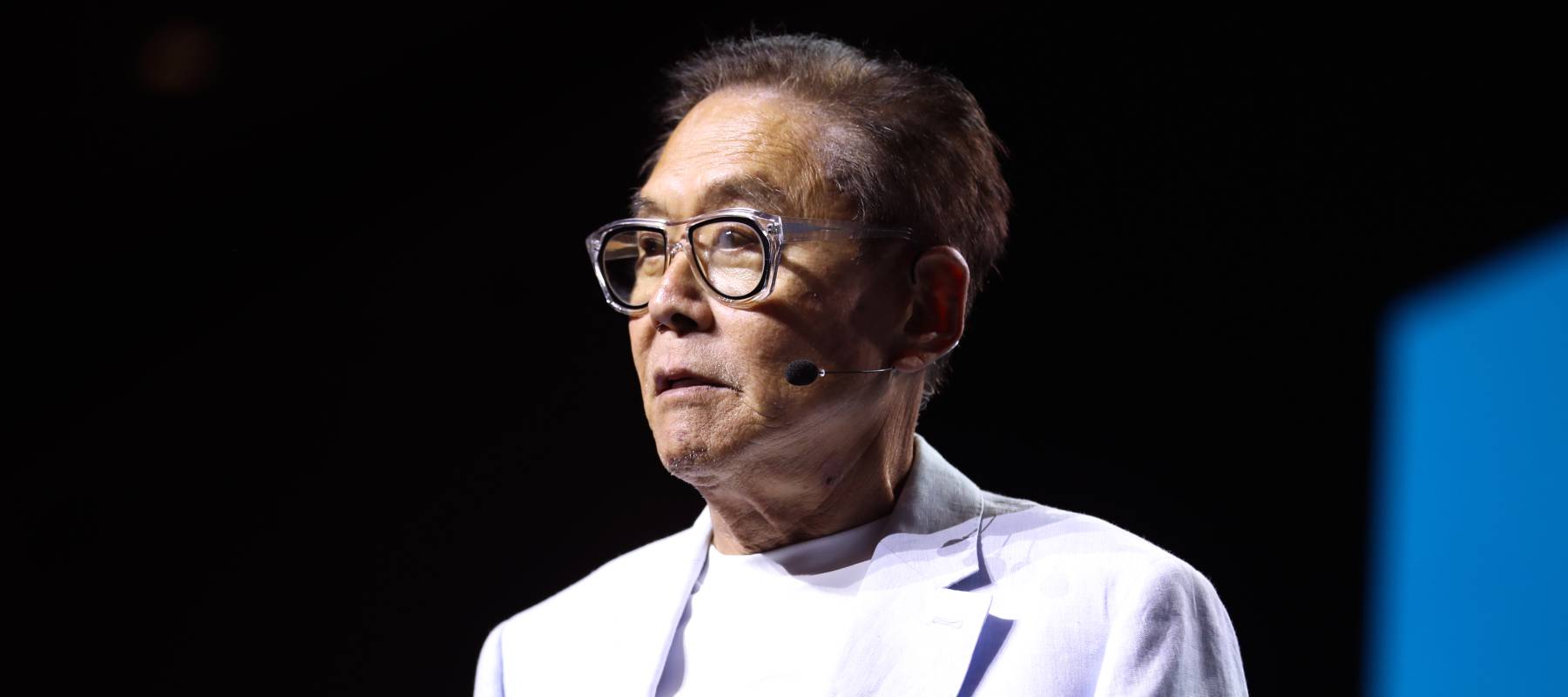 Robert Kiyosaki speaking with attendees at the 2024 FreedomFest at Caesars Forum Conference Center in Las Vegas, Nevada.