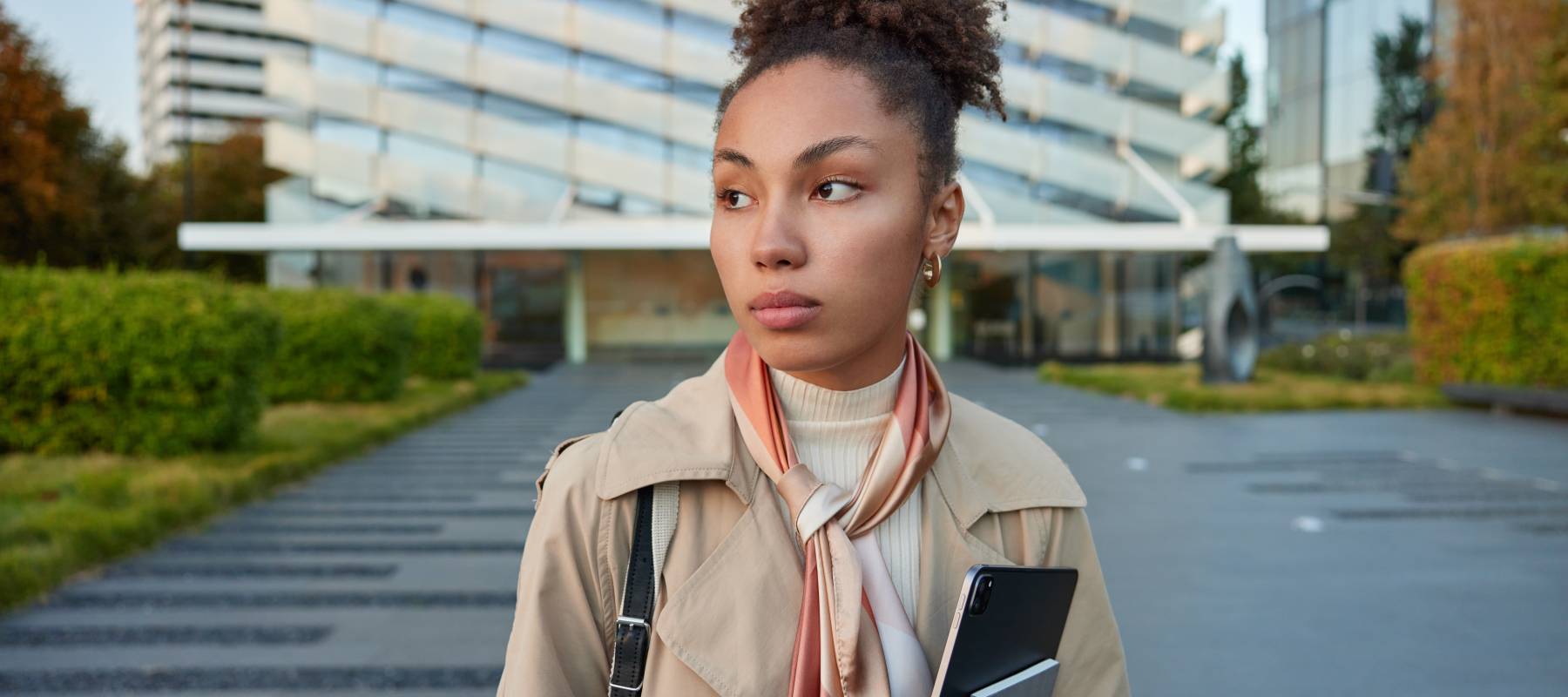 A woman walking away from an office building could be one of many workers navigating a workplace where job loyalty no longer guarantees financial security.