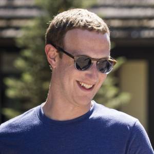 Mark Zuckerberg, Dan Rose and Sheryl Sandberg walk next to each other at the Sun Valley billionaire's retreat.