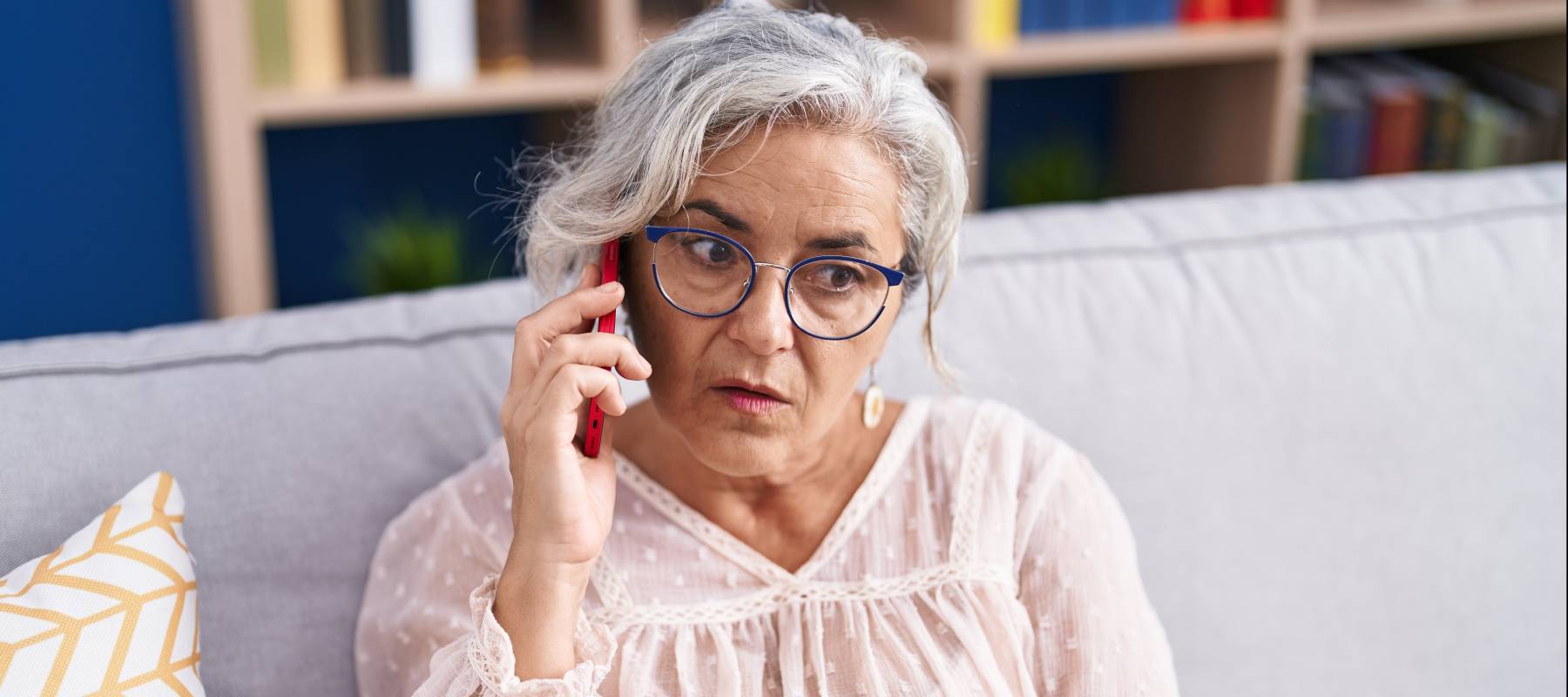 A frustrated woman talks on the phone.