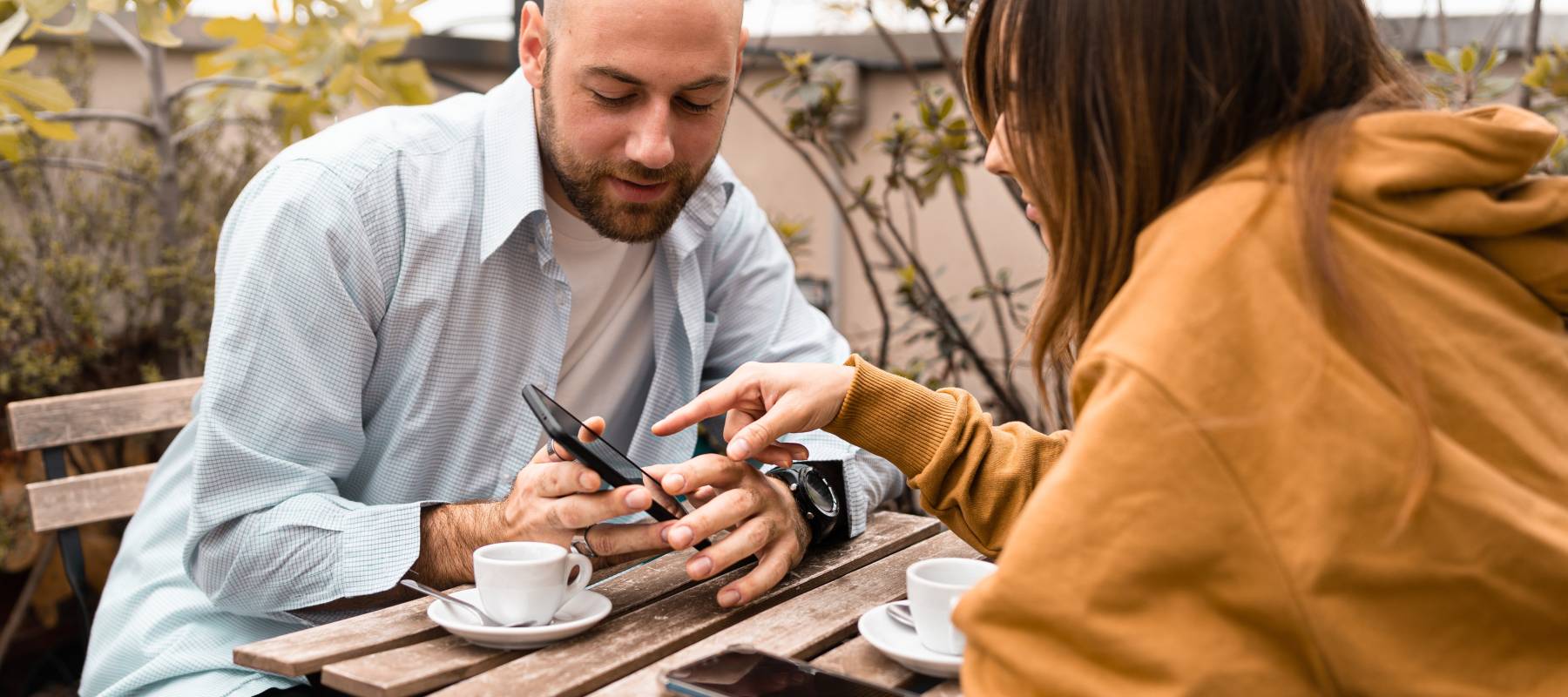 A couple, looking at a smartphone, could be one of many Americans who feel uncomfortable with their financial security in 2026.