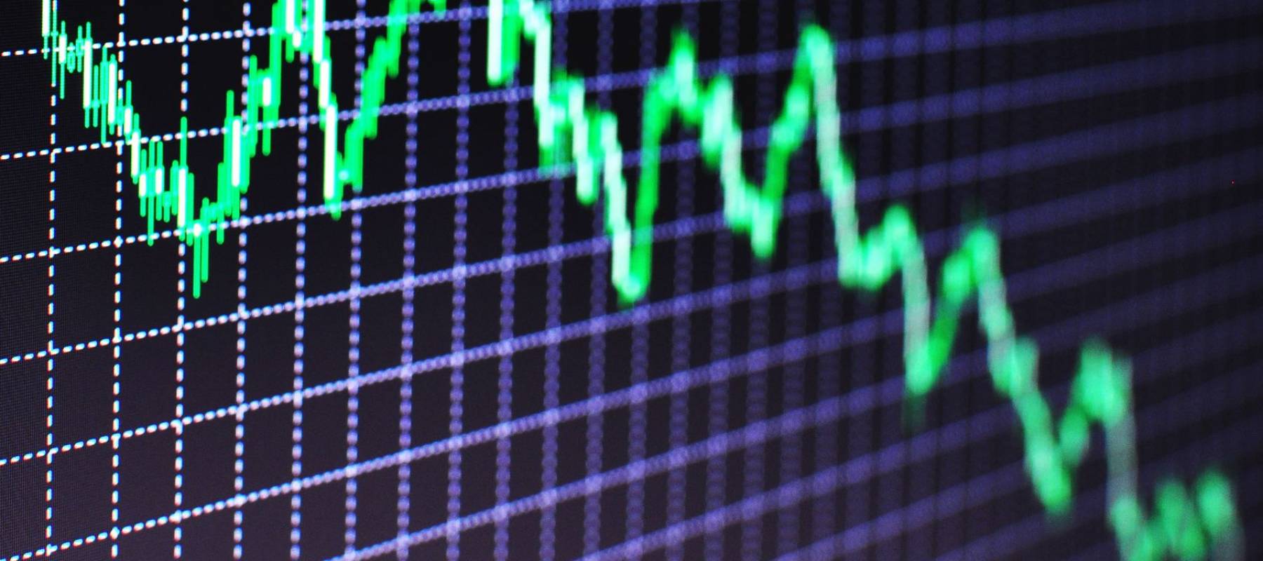 Concerned business people looking at financial report on computer screen at office