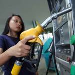 Kuala Lumpur/Malaysia-December 4 2019- A women refuel her car with petrol at Petronas gas station in Kuala Lumpur