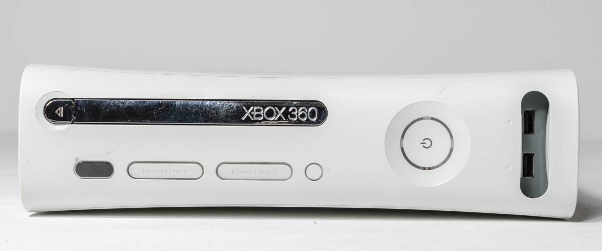 Xbox 360 gaming system laying on its side