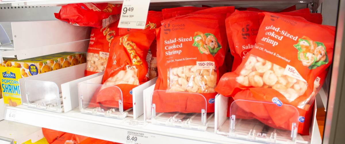 Refrigerated bags of shrimp at grocery store