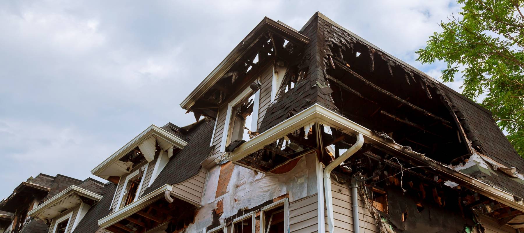 View of a house with pieces missing shot from below.