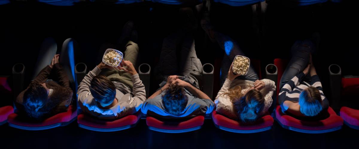 Group of people sitting in movie theater