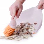cleaning up money isolated on a white background