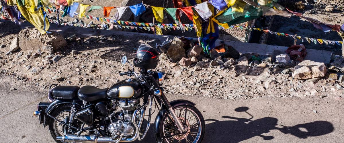 2017 October 15th,Agra India : Black Royal enfield bike with Tibetan flags in Leh city