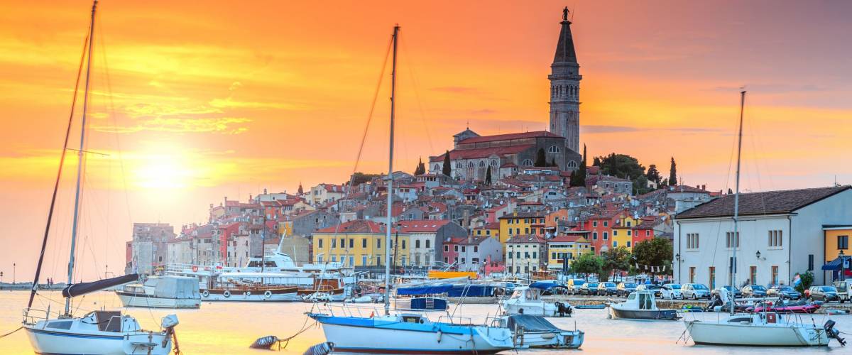 Wonderful romantic old town of Rovinj and famous fishing harbor with magical sunset,Istrian Peninsula,Croatia,Europe