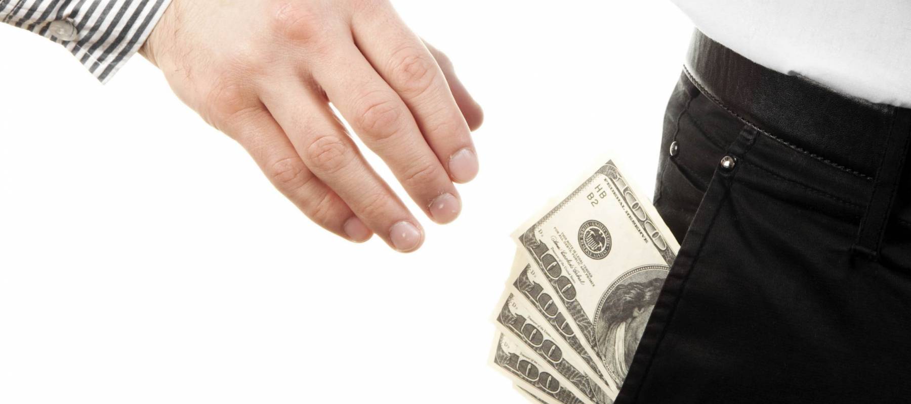 Hand taking money from pocket