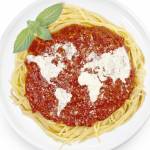 Freshly cooked dish of tasty pasta with tomato sauce and parmesan cheese in the shape of the world .(series)