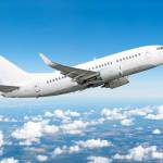 Airplane in the sky above the clouds flight journey sun height.