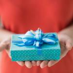 Close-up of female hands holding a present