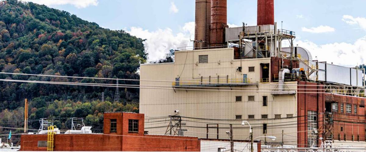 Charleston, West Virginia, USA capital city with industrial factory smoke stack coal pipes power plant building exterior architecture