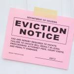 Pink Eviction Notice Taped on Front Door.