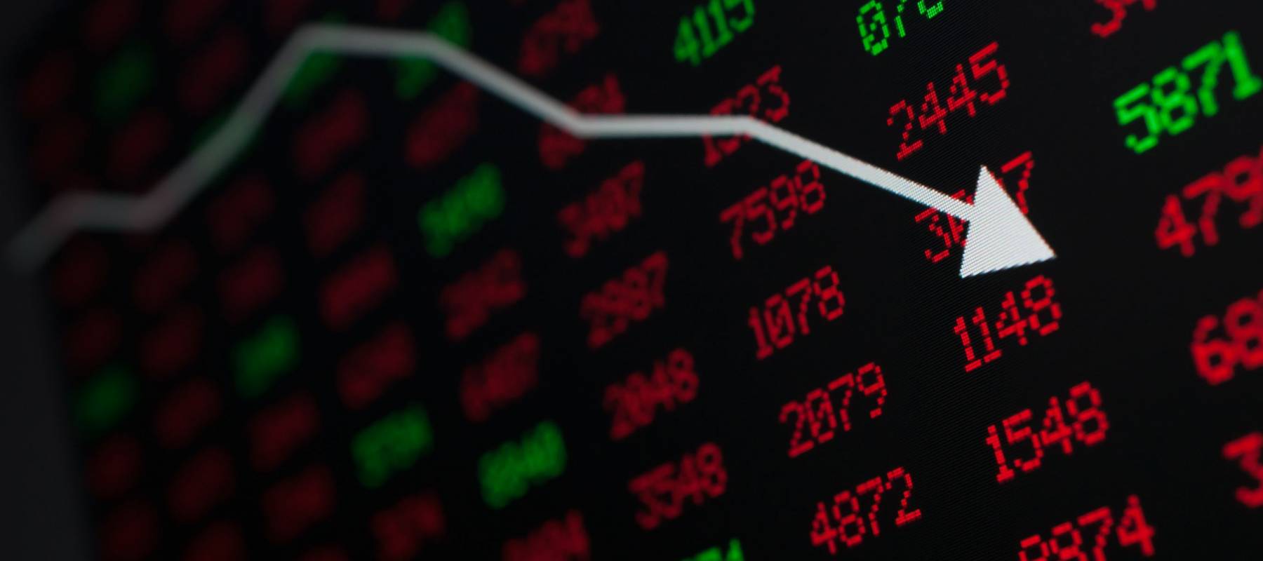 Stock Market - Arrow Graph Going Down on Display With Red and Green Figures