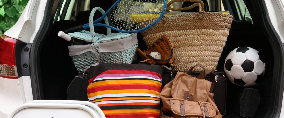 Suitcases and bags in trunk of car ready to depart for holidays