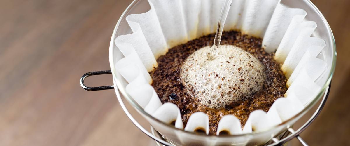 Coffee pouring over filter