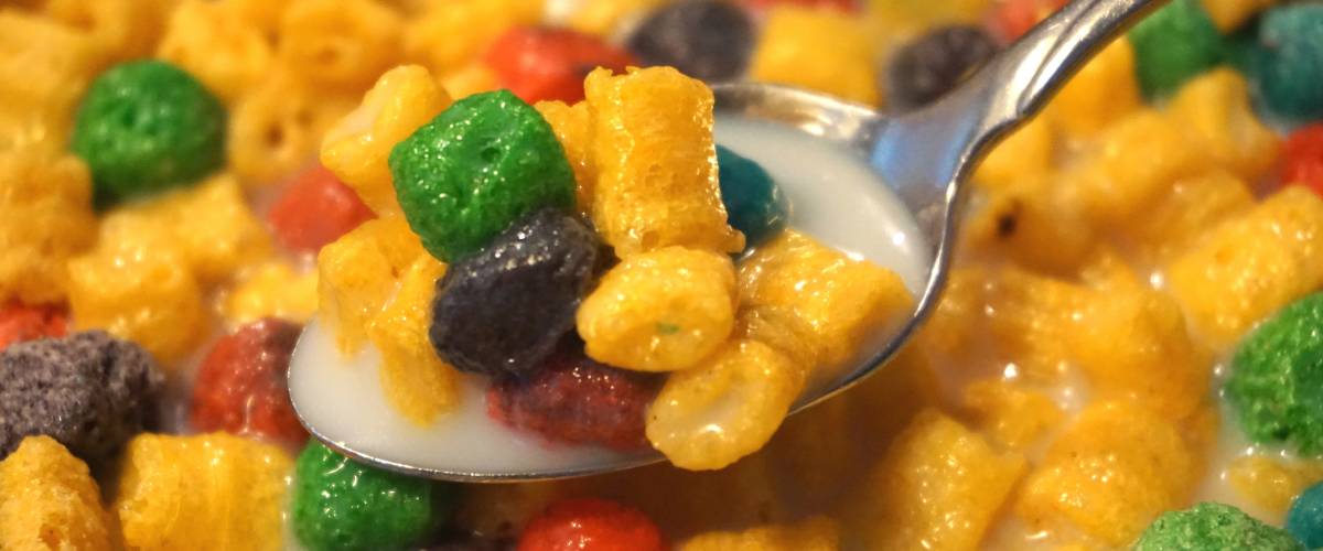 Colorful Breakfast Cereal in Milk with Spoon