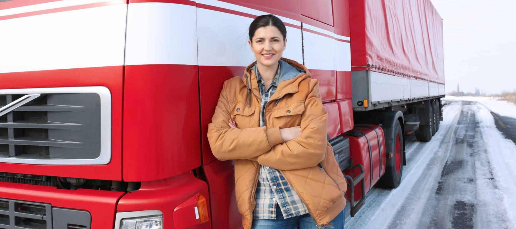 Female driver near big modern truck outdoors