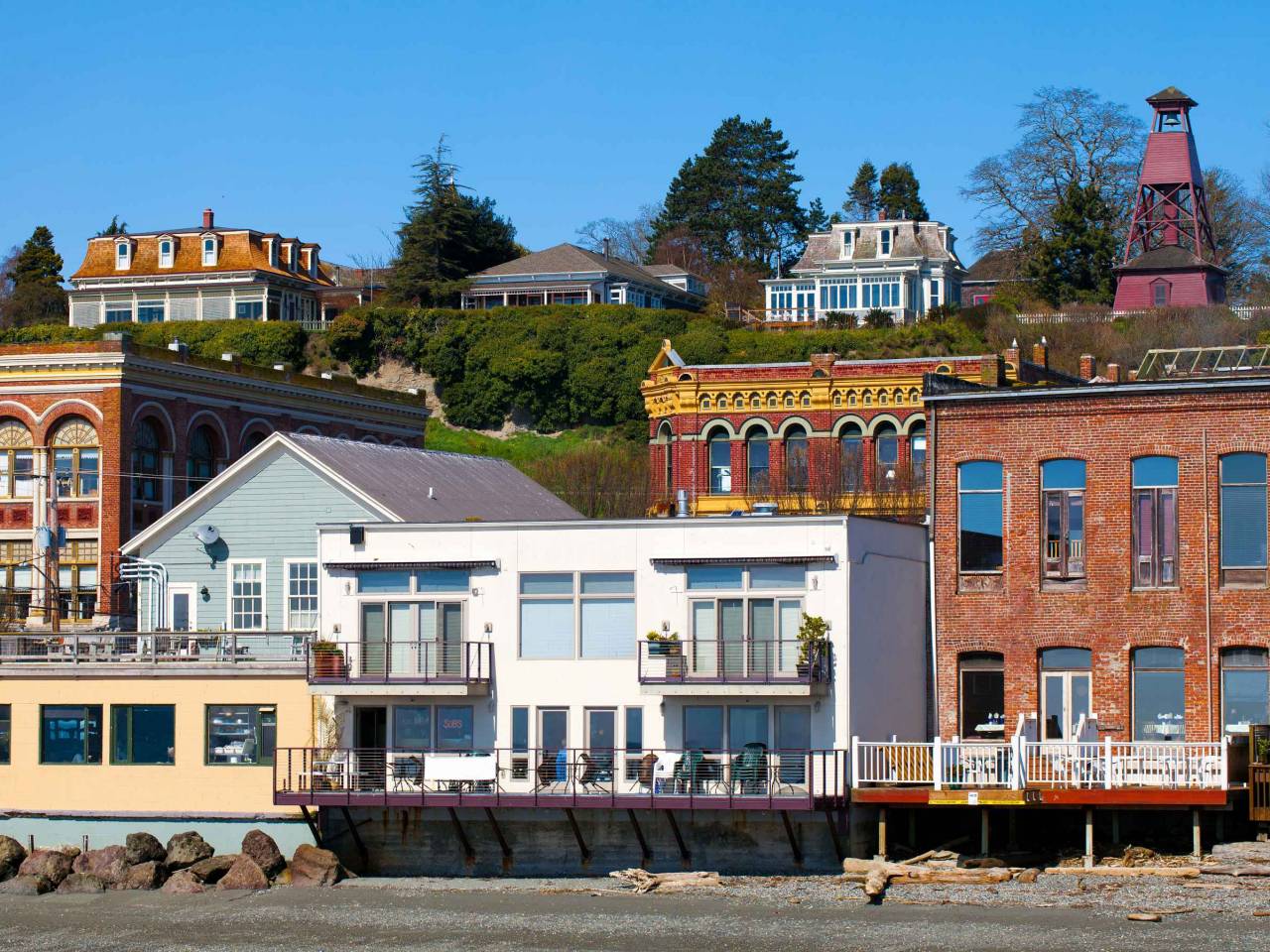 Port Townsend, Washington waterfront view of old Victorian era architecture on a clear sunny day with blue sky. Tourist destination on the Olympic Peninsula in the northwest USA.