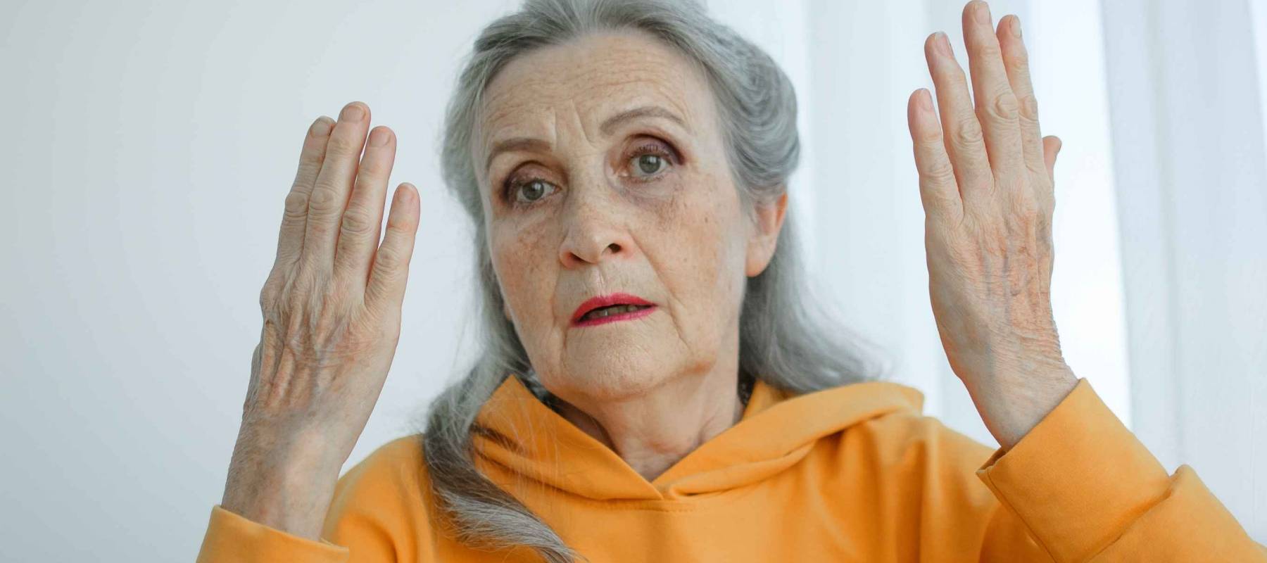 Closeup portrait of angry upset senior mature woman talking with someone and looking at the camera. Negative emotion, facial expression, scandal