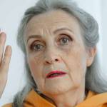 Closeup portrait of angry upset senior mature woman talking with someone and looking at the camera. Negative emotion, facial expression, scandal